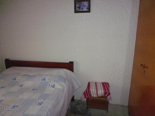 a bedroom with a bed and a picture on the wall at Kulla e Sadri Lukes in Theth