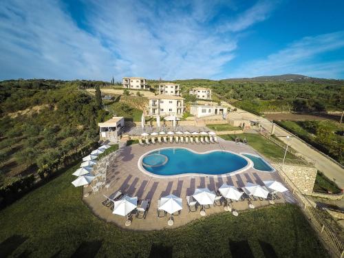 an aerial view of a house with a swimming pool at Baywatch Hotel in Chrani