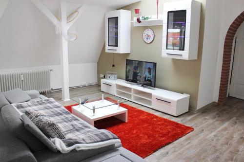 Télévision ou salle de divertissement dans l'établissement Hafencity Apartments