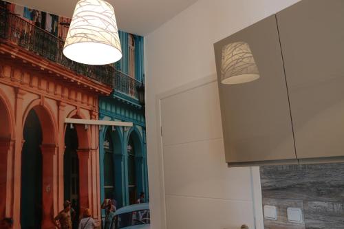 a group of people walking around a building with lights at Luma 2 in Osijek