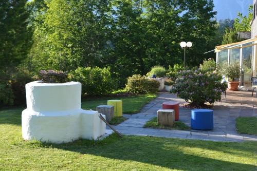 a cake sitting on the grass in a yard at Hotel Leitgebhof in Innsbruck