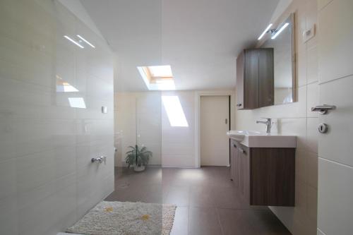 a bathroom with a sink and a mirror at Apartments Jadranka Sain in Novigrad Istria