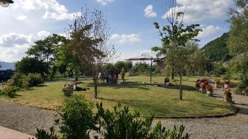 a group of people standing in a park at Agriturismo Ca' di Mazza in Monzuno