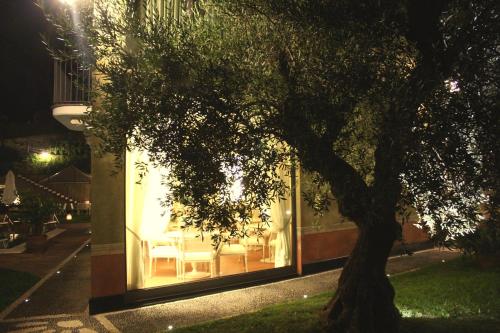 a glass building with a tree in front of it at Villa Agnese in Sestri Levante