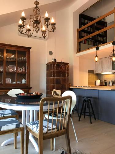 a kitchen and dining room with a table and chairs at Sajeta Beach Apartments in Drvenik