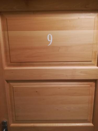 a wooden drawer with the number on it at Cinema House Single & Double Rooms & Studio Apartments in Pula