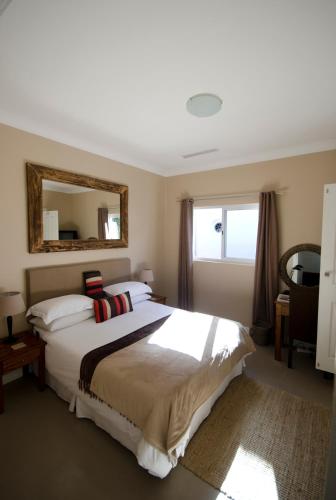 Letto o letti in una camera di Villa Costa Rose