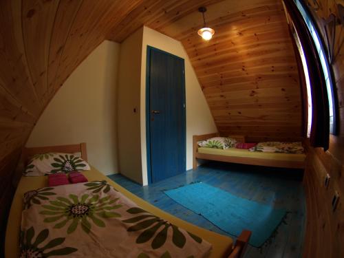 Кровать или кровати в номере Apartment Bajka
