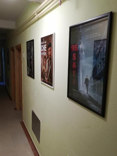 a wall with three movie posters on it at Cinema House Single & Double Rooms & Studio Apartments in Pula