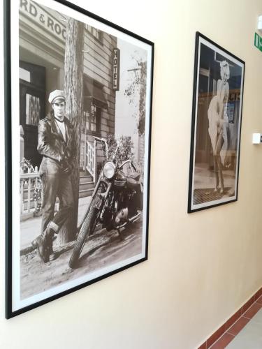 a picture of a man and a motorcycle on a wall at Cinema House Single & Double Rooms & Studio Apartments in Pula