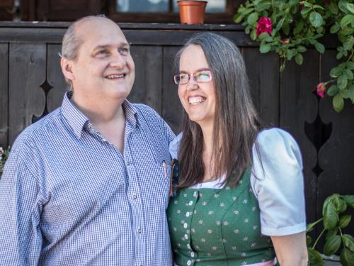 a man and a woman standing next to each other at Hotel Garni Alpenblick in Bergen