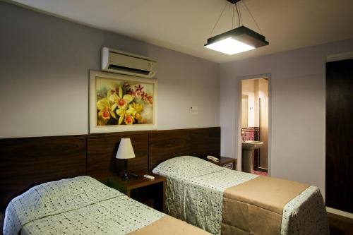 Katil atau katil-katil dalam bilik di Gallant Hotel