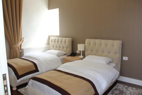 Hotel Vila Alfaにあるベッド