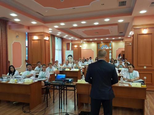 a man standing in front of a group of people in a room at Hotel Lyhnidas in Pogradec