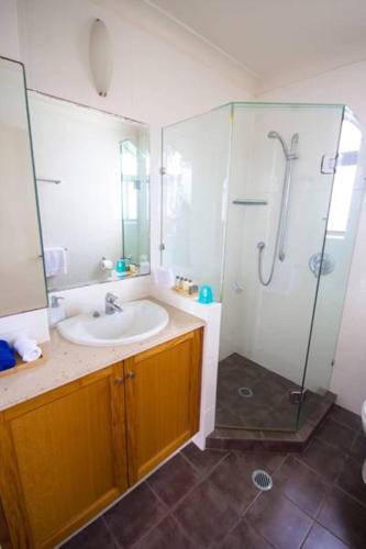 a bathroom with a sink and a shower at Albatross North Apartments in Gold Coast