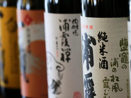 two bottles of wine with asian writing on them at Komao in Kiso