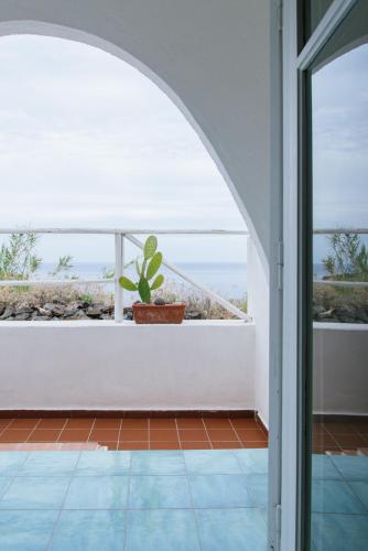 a room with a view of the ocean at Hotel Punta Scario in Malfa