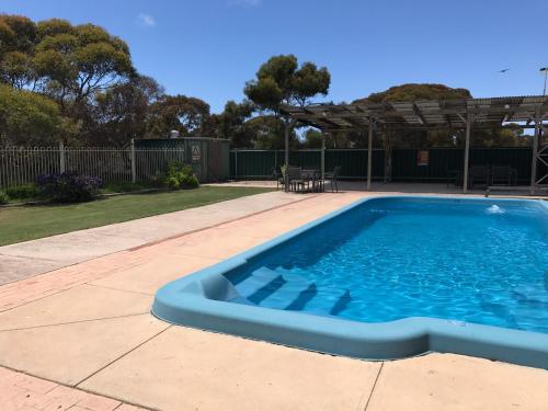 a swimming pool in the middle of a yard at Border Village Roadhouse in Border Village