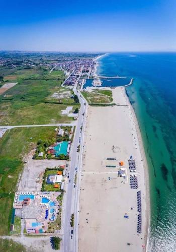 an aerial view of an island in the ocean at Hotel Aperio in Paralia Katerinis