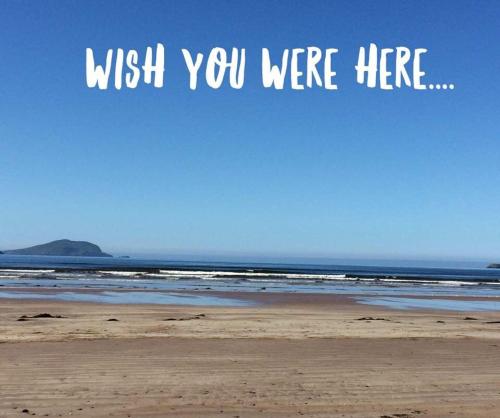 a picture of the beach with the words wish you were here at Skellig Port Accomodation - 2 Bed Apartment in Portmagee