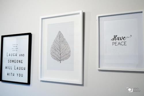 three framed prints of a leaf on a wall at iKON Self-Catering in Windhoek