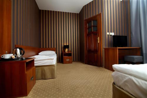Ein Bett oder Betten in einem Zimmer der Unterkunft Amadeus
