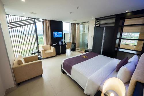 Tempat tidur dalam kamar di Azumaya Hotel Da Nang