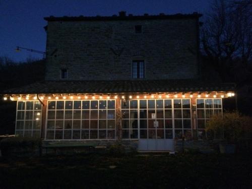 a building with lights on it at night at b&b LATORDICELLA in Castel del Rio