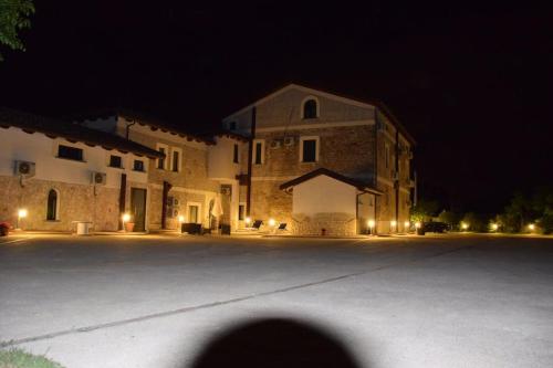 a large building at night with a basketball court at Tenuta Ferrara in Altavilla Silentina