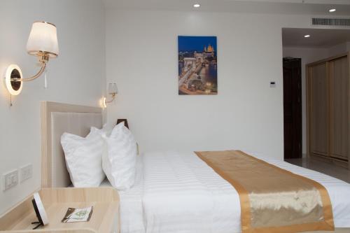 Ein Bett oder Betten in einem Zimmer der Unterkunft One El Nido Suite