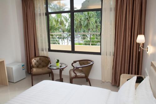 Ein Bett oder Betten in einem Zimmer der Unterkunft One El Nido Suite