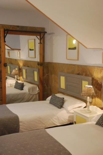 Säng eller sängar i ett rum på Casa Bartulo