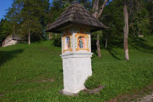 a small house with a roof in the grass at Chalet ApArt Kupljenik 12 A, Bled in Bohinjska Bela