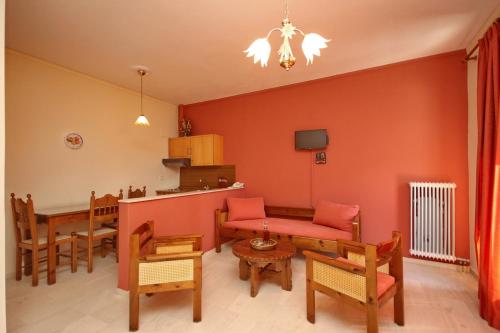 a living room with a couch and a table at Hotel Marialena in Ancient Epidavros