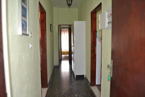 an empty hallway with two doors and a hallway at House Souzanna in Toroni