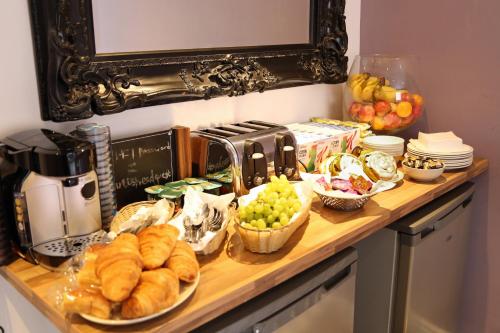 a kitchen counter filled with lots of different types of food at The Bulls Head Hotel in Manchester