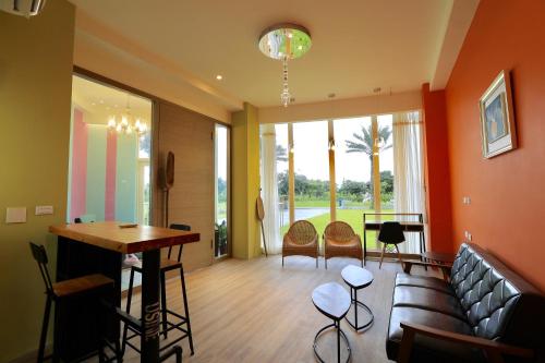 a living room with a couch and a table at The Riverview Retreats in Wujie