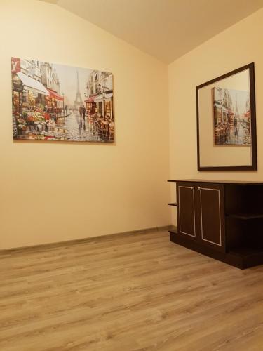 a room with a table and two pictures on the wall at Hotel Panorama in Panichishte