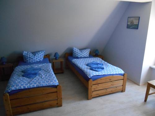 Tempat tidur dalam kamar di Pension Gut Grabitz