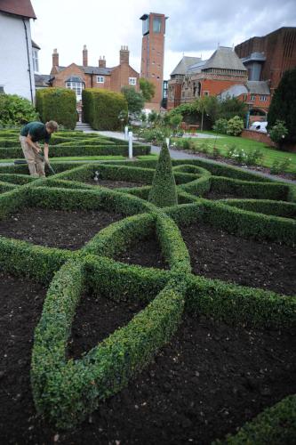 a man standing in front of a hedge maze at The Arden Hotel Stratford - Eden Hotel Collection in Stratford-upon-Avon