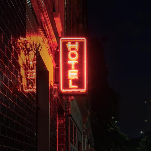 a neon sign on the side of a building at Camden Enterprise Hotel in London