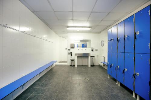 a hospital room with blue lockers and a desk at Olarain in Donostia-San Sebastián