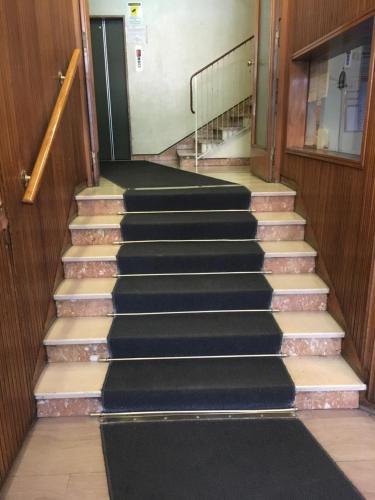 a set of stairs in a building at Riva Reno 4 Rooms in Bologna