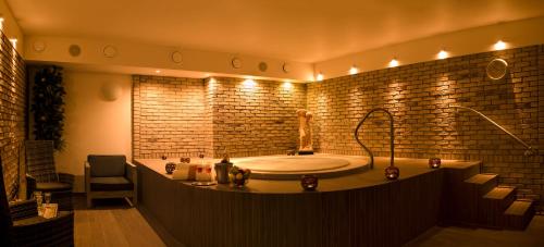 a large bathroom with a tub with lights at CAMP VARY - Vítkova Hora in Karlovy Vary