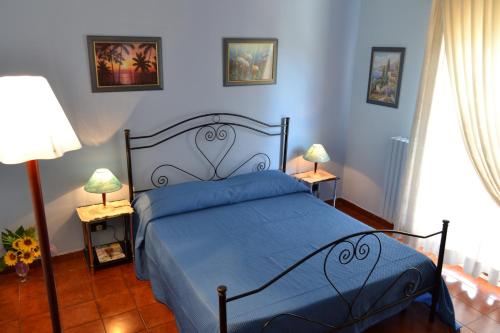 Postel nebo postele na pokoji v ubytování Cassiodoro Rooms Affittacamere