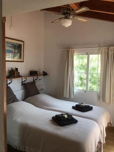 a bedroom with two beds with towels on them at Buena Idea - Adults Only in Jalón
