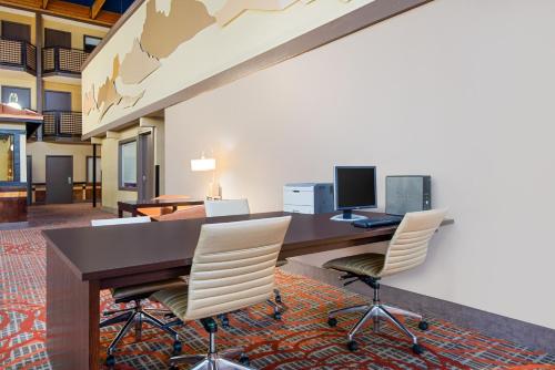 an office with a desk with two chairs and a computer at Red Lion Hotel Gillette in Gillette
