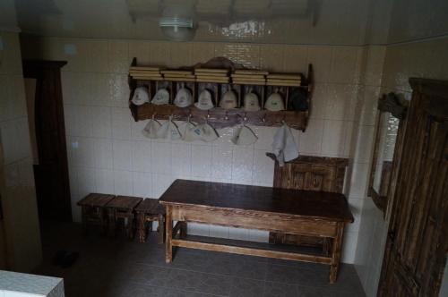 a room with a table and cups on the wall at Panorama Yasinya in Yasinya