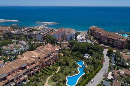 a scenic view of a city with a large body of water at Mimosas Suites Banús in Marbella