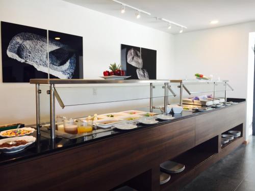 a buffet with a lot of food on display at La Quinta by Wyndham San Jose Chiapa Puebla in San José Chiapa